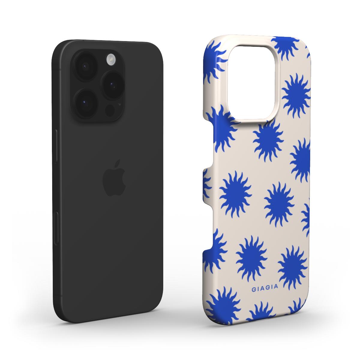 Black phone case next to a beige phone case with blue starburst pattern on a white background