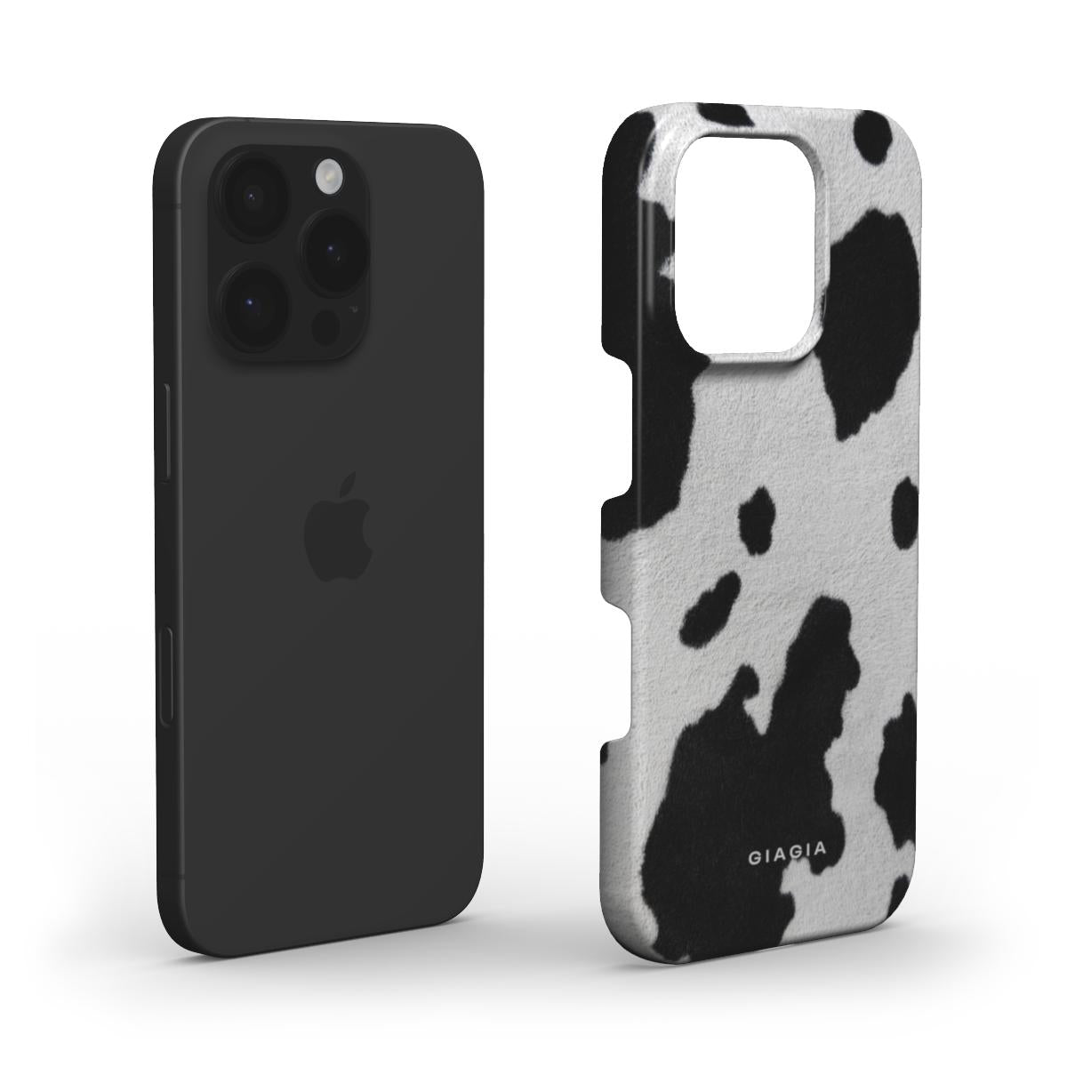 Black phone case and cow print phone case on a white background