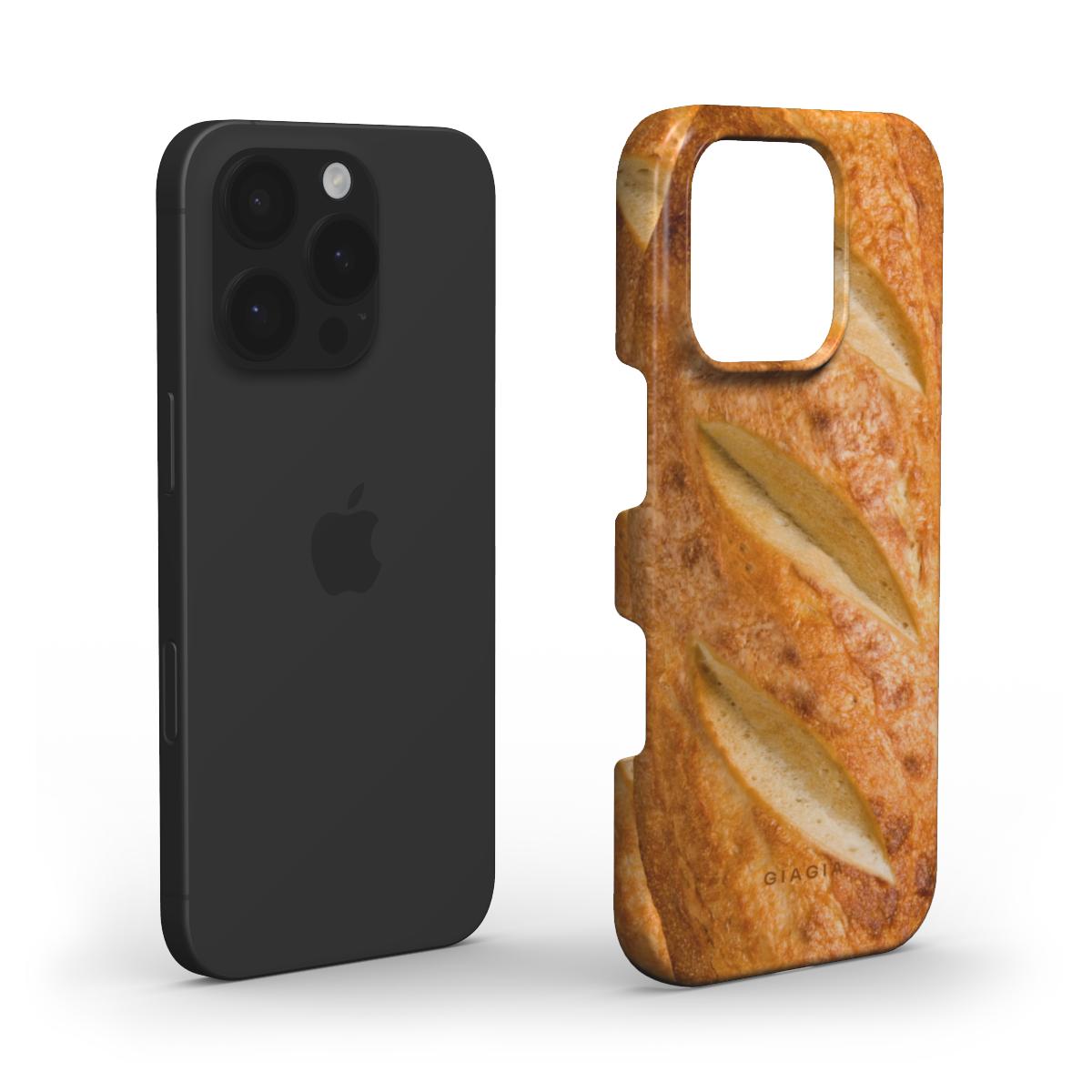 Black phone case next to a phone case with bread design on a white background